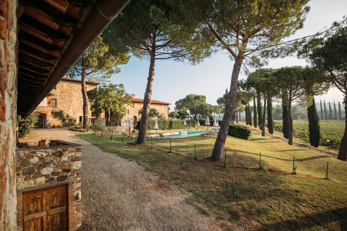 Tuscan stone villa with a pool and umbrella pines